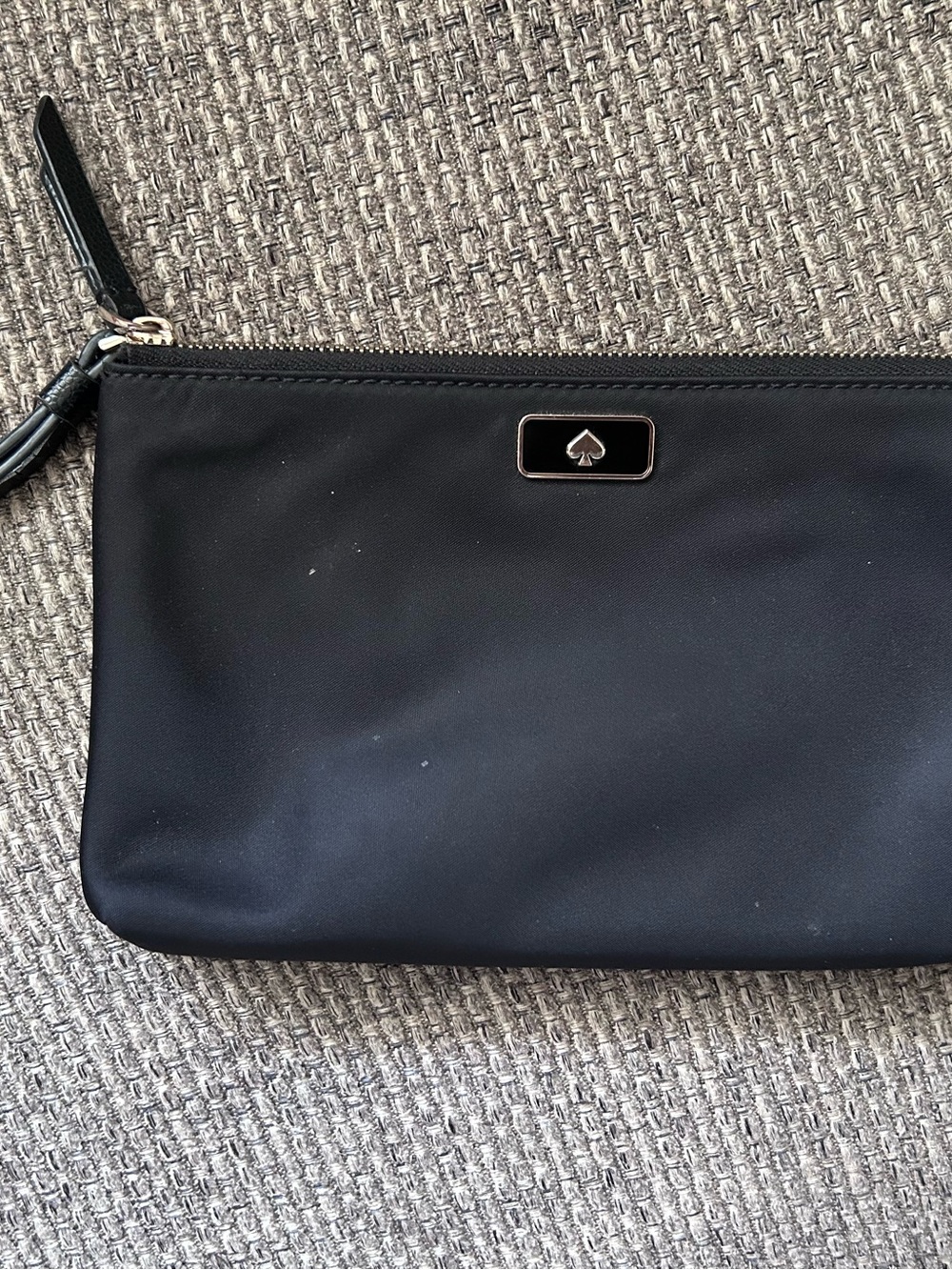kate spade black zip wristlet with spade emblem